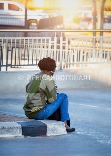 African woman texting