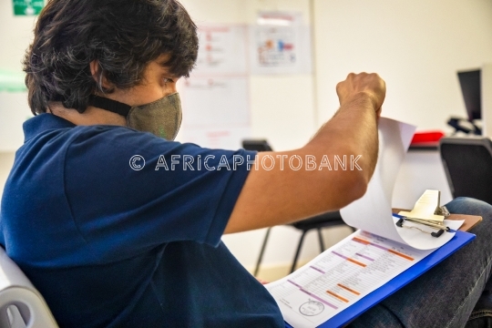 man checking documents