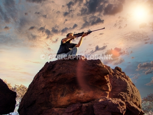hunter on rocks