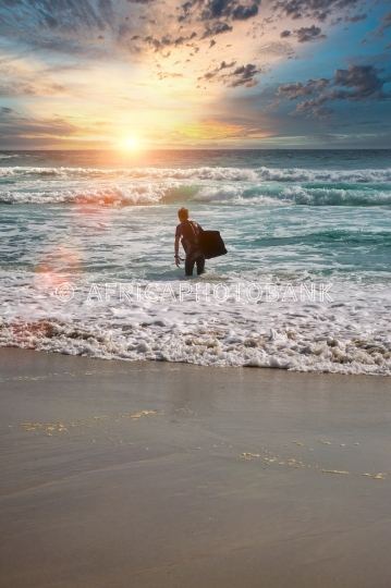 surfer enter ocean