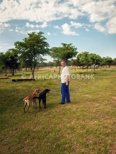 Farmer with dogs