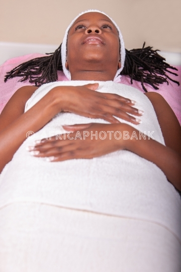 braided african woman in a spa