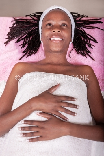 braided african woman in a spa