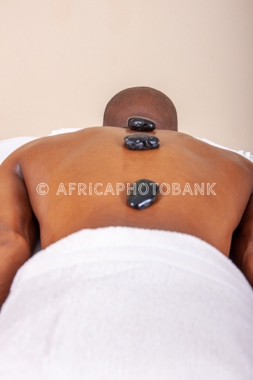 african man stone massage