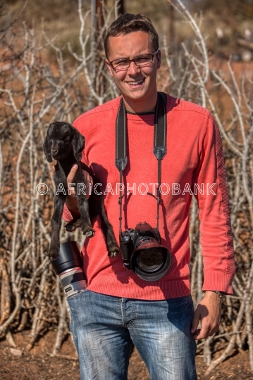 photographer with baby goat