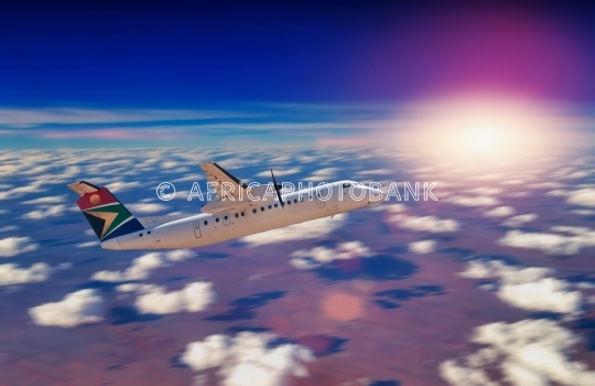 airliner above clouds