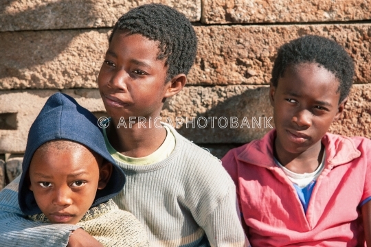 African brothers in front of the house