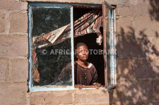 African woman in the window