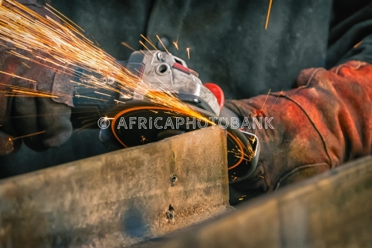 african man grinding