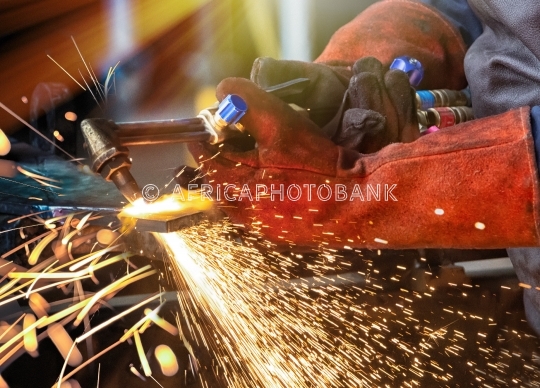 man with cutting torch