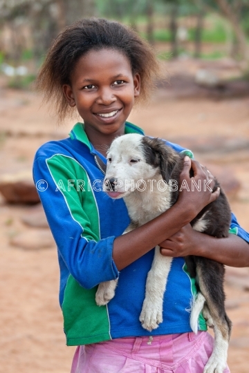Village African girl with dog